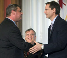 In this June 2008 photo Ontario Premier Dalton McGuinty shakes hands with David Caplan after he was sworn in as health minister. Lieutenant Governor David Onley looks on.  (Adrian Wyld/Canadian Press).