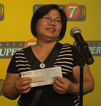 Lydia Nono, 49, collects $20-million at OLG in Toronto, July 28, 2009. A single mother, she had been laid off 16 months before from her factory job making paper cups for Tim Hortons. She had been playing the lottery in Ontario for 20 years.