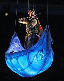 Fiddler Ashley MacIsaac performs in suspended canoe during the opening ceremony of 2010 Winter Olympics in beautiful Vancouver, BC, Friday, February 12. Photograph by: John Mahoney/Canwest News Service.