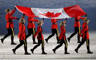 There had to be Mounties of course. Here they carry the Canadian flag to be raised at the opening ceremony. Photograph by: Larry Wong, Canwest News Service.