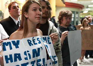 Madi Wozny comes to the forum with barely the clothes on her back as University of Calgary Provost Alan Harrison drew of crowd of hundreds to address students in council chambers as well as in a simulcast in the MacEwan Student Centre on tuition increases February 2. She is a Music Education student. Photograph by: Ted Rhodes, Calgary Herald.